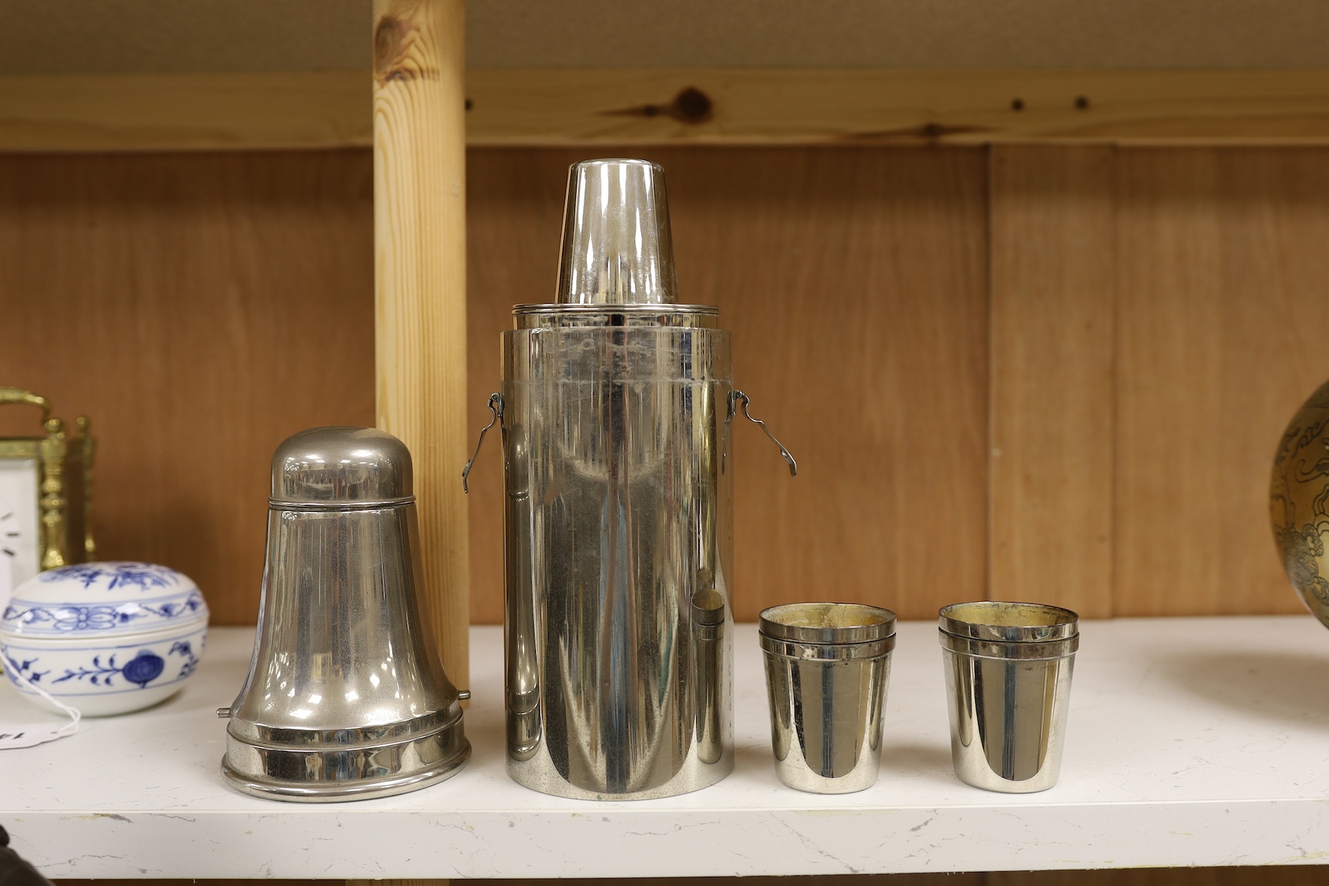 A 1920's chrome plated travelling cocktail flask set and two similar cased bottles, tallest 28.5cm high. Condition - fair